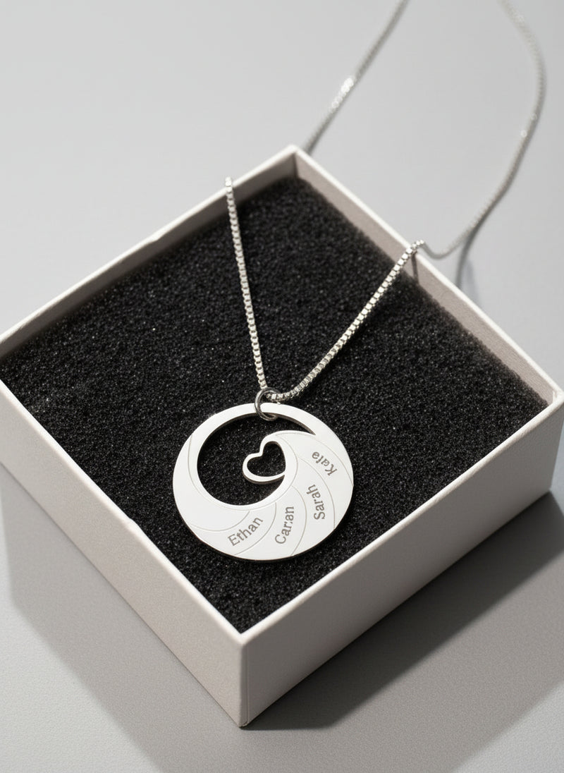 Silver necklace with a unique pendant in a box on a black background