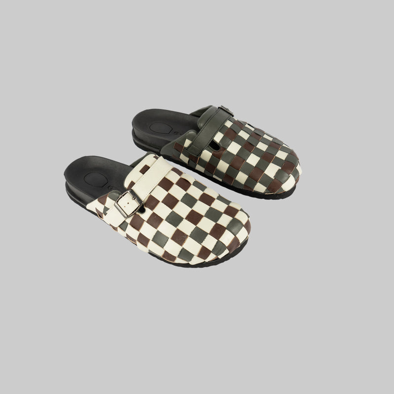Pair of checkered clogs on a white background